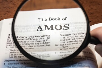 Wall Mural - title page book of amos close up using magnifying glass in the bible or Torah for faith, christian, hebrew, israelite, history, religion, christianity, Old Testament