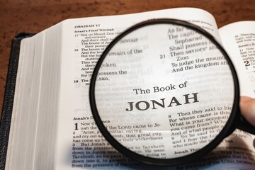 Wall Mural - title page book of jonah close up using magnifying glass in the bible or Torah for faith, christian, hebrew, israelite, history, religion, christianity, Old Testament
