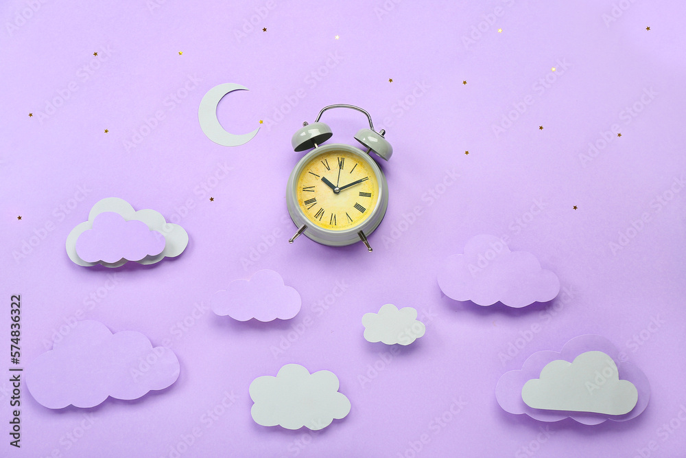 Composition with alarm clock and paper decor on color background. World Sleep Day concept