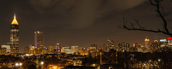 Wall Mural - Atlanta City Skyline at Night with Skyscrapers and Buildings at Cloudy Twilight over the Trees in Georgia