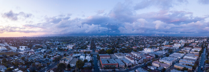 Canvas Print - Cloudy sunset over the Los Angeles neighborhood Mar Vista. Aerial pictures taken with a drone. From this height, you can see downtown Los Angeles, mountains, and the Pacific Ocean.