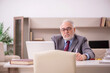 © Elnur - Old male employee working from home during pandemic
