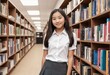 © orelphoto - Asian student or schoolgirl in library. Generative AI