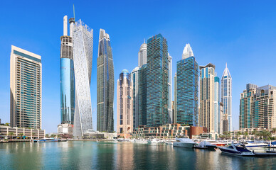 Wall Mural - Dubai marina promenade in UAE. Highrise residential buildings, business skyscrapers