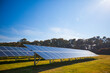 © Cavan Images - View of solar panels under blue sky