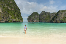 Woman Walking On The Lonely Beach Of Maya Bay