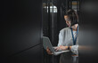 © Kirsten D/peopleimages.com - Woman with laptop, datacenter and information technology, engineer and server room with software update. Tech industry, cybersecurity and network with Asian female setting up firewall and database