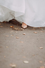 Wall Mural - The brides leg peeks out from behind the edge of the dress when walking 4413.