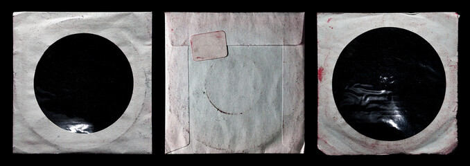 Wall Mural - dirty worn paper cd sleeve collection isolated on black background