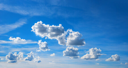 Wall Mural - blue sky background with high cirrostratus and floating cumulus clouds
