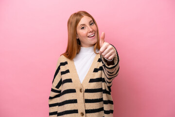 Poster - Young redhead woman isolated on pink background with thumbs up because something good has happened