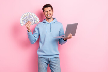 Poster - Photo of charming cute guy dressed blue sweatshirt winning cash modern gadget isolated pink color background