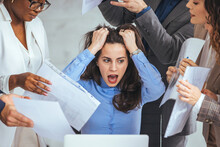 Stressed Overwhelmed Businesswoman Feels Tired At Corporate Meeting, Exhausted  Female Boss Suffering From Headache Touching Temples At Team Briefing, Stress At Work Or Migraine Concept