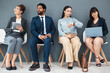 © Allistair F/peopleimages.com - Hiring, job interview and time with business people in waiting room for schedule, hr or consulting. Recruitment, networking and clock with employee for search, countdown or watch with wall background