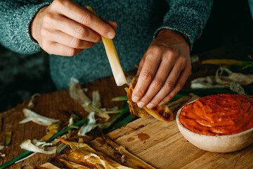 Poster - peeling off a calcot typical of Catalonia, Spain