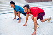 eastern ethnic people exercising together outdoor on sun light