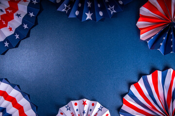 Happy Labor Day, Presidents Day, Fourth of July Independent Day, Memorial day, Columbus day background. Dark blue background with USA flag color paper fans and decorations, party accessories