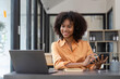 © Natee Meepian - Accountant black woman working on laptop and do document, tax, exchange, accounting and Financial advisor concept
