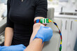© Austockphoto - Female patient with tourniquet on her arm while a health care worker wiping her arm with wet tissue