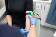 © Austockphoto - Close up shot of a woman with a tourniquet on her arms for a blood test in the clinic