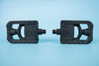 folding bicycle pedals, part of a folding bicycle, isolated on blue background