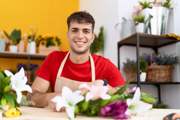 Poster - Young hispanic man florist make bouquet of flowers at flower shop