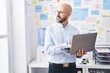 © Krakenimages.com - Young bald man business worker using laptop working at office