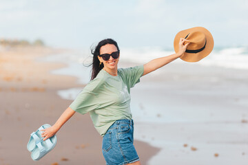 Poster - Portrait of young woman on the beach