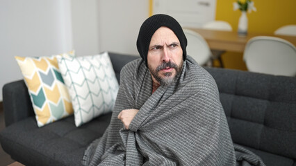 Sticker - Young bald man covering with blanket for cold at home