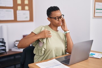 Wall Mural - African american woman business worker stressed using laptop at office