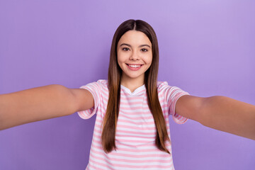 Poster - Photo of cheerful adorable lady wear striped white t-shirt smiling recording video isolated violet color background