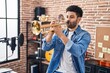 © Krakenimages.com - Young arab man musician playing trumpet at music studio