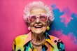 canvas print picture - Portrait of adorable retired old woman wearing colorful fashionable clothes over pink background. Generative AI