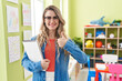 © Krakenimages.com - Young caucasian woman working as teacher at kindergarten smiling happy and positive, thumb up doing excellent and approval sign