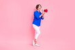 Full length photo of excited bob brown hair woman scream loud voice megaphone activist wear blue shirt white pants isolated on pink color background