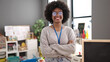 © Krakenimages.com - African american woman teacher smiling confident standing with arms crossed gesture at kindergarten