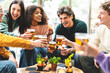 © Nicolas Micolani - Multiracial friends drinking and toasting beer at brewery bar pub-Happy diverse people cheering glasses and having fun enjoying happy hour celebrating party-Beverage life style concept with guys