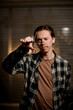 © fesenko - selective focus on professional hairdressing scissors in male barber hand
