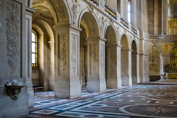 paris ancient cathedral interior with large arched windows, stone walls, stucco fretwork, mosaic flo