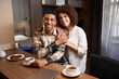 © Svitlana - Beautiful multiracial young couple having morning coffee