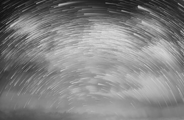 Wall Mural - Star trails in a night sky, Meteor shower in the night sky, Star long exposure, Abstract star trails in sky.