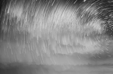 Wall Mural - Star trails in a night sky, Meteor shower in the night sky, Star long exposure, Abstract star trails in sky.