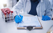 © Azee Jacobs/peopleimages.com - Blood test, science documents and hands in laboratory for healthcare results, research or review development. Scientist, medicine and writing medical results of dna investigation, paperwork or report