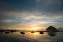 The Sun Sets Over Anchored Boats In Morro Bay, Calif.