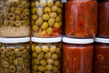 Canned Jars Of Olives And Salsa.