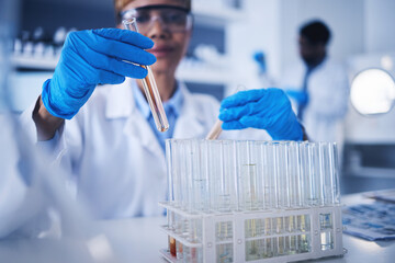 Science, test tube in hands and black woman in laboratory for research, medical study and experiment. Healthcare, pharmaceutical and female scientist with liquid vial, medicine and vaccine in clinic