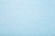 Light blue dry soft microfiber rag background. Closeup. Pastel color. Empty place for text. Top down view.