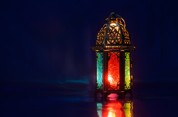 Wall Mural - Lantern puts on table with dark blue background for the Muslim feast of the holy month of Ramadan Kareem.