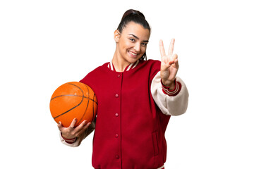 Poster - Young Woman playing basketball over isolated chroma key background smiling and showing victory sign