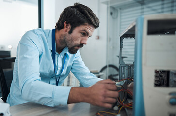 Leinwandbilder - Serious man, it or technician fixing computer, PC or processor in engineering service workshop. Worker, CPU or hardware for repair, maintenance or software upgrade in information technology industry